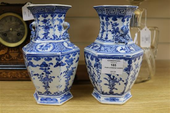 A pair of Chinese blue and white hexagonal vases, 19th century, 20.5cm (a.f.)